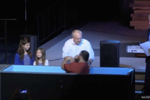 Pastor Robert Hogan of the Spring First Church in Houston, Texas baptizes Jacob McKelvy, founder of the Greater Church of Lucifer. <br/>Screenshot/YouTube/Jacob McKelvy