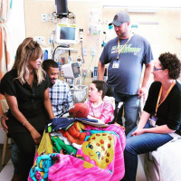 Russell Wilson and Ciara visit a young fan battling cancer at Seattle Children's Hospital. <br/>Instagram