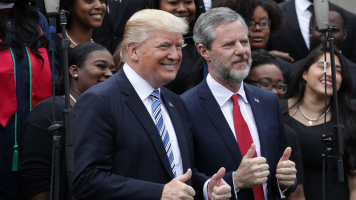 President Trump poses with Liberty University President Jerry Falwell Jr., during commencement at Liberty University May 13 in Lynchburg, Va. <br/> Alex Wong/Getty Images