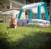 Indy Feek sits by her kiddie pool <br/>Facebook