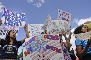 Supporters of Deferred Action for Childhood Arrival program (DACA) demonstrate on Pennsylvania Avenue in front of the White House on Sept. 9.  <br/>Pablo Martinez Monsivais/AP