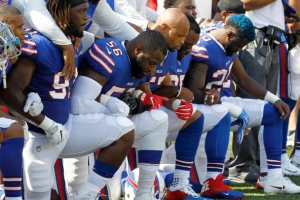 Buffalo Bills players kneel during the national anthem before a game versus the Denver Broncos. <br/>AP Photo/Jeffrey T. Barnes
