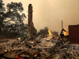  The remains of fire damaged homes after an out of control wildfire moved through. <br/>California wildfires
