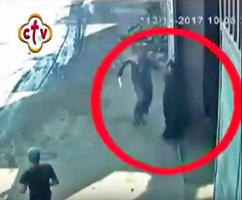 Assailant arriving at warehouse door in pursuit of Coptic Orthodox bishop on outskirts of Cairo, Egypt. (Screen grab of security footage) <br/>Morning Star News