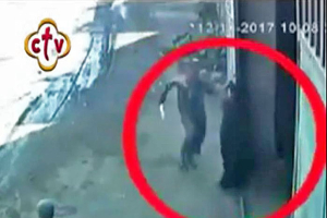 Assailant arriving at warehouse door in pursuit of Coptic Orthodox bishop on outskirts of Cairo, Egypt. (Screen grab of security footage) <br/>Morning Star News