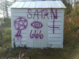 The Air Force members allegedly spray painted satanic messages on the 250-year-old church<br />
 <br/>(Sumter County Sheriff's Office)