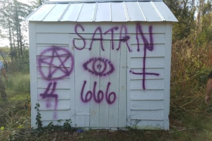 The Air Force members allegedly spray painted satanic messages on the 250-year-old church<br />
 <br/>(Sumter County Sheriff's Office)