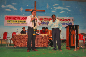 Rev. Thom Braun (standing at left), from New Hope Church Niagara, preaches at a Good Samaritan India church. <br/>Intercede