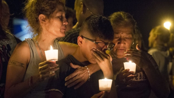 A gunman in ‘full gear’ walked into First Baptist Church outside San Antonio, Texas, and opened fire, killing scores and wounding more than a dozen, including children. <br/>AP Photo