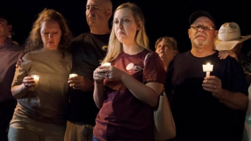 Mourners participate in a candlelight vigil held for the victims of a fatal shooting at the First Baptist Church of Sutherland Springs, Sunday, Nov. 5, 2017, in Sutherland Springs, Texas.  <br/>AP Photo