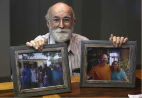 Joe Holcombe holds photos of his family Tuesday, Nov. 28, 2017 showing some of the people killed in the Sutherland Springs First Baptist Church shooting.  <br/>San Antonio Express News