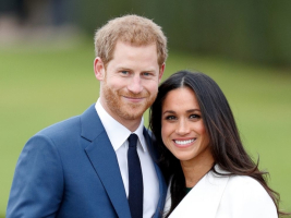 Britains Prince Harry poses with his fiancee Meghan Markle during a photocall after announcing their engagement. <br/>Reuters