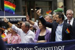 (L-R) New York Mayor Michael Bloomberg, New York City Council Speaker Christine C. Quinn, and New York Governor Andrew Cuomo march together during the Gay Pride Parade in New York June 26, 2011. <br/>Reuters / Jessica Rinaldi