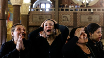 Copts mourn their dead after a suicide bomb at St Mark’s Cathedral In Alexandria<br />
<br />
 <br/>SAMER ABDALLAH/AP