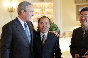 Li Baiguang, pictured with former President George W. Bush, died under “mysterious” circumstances, supporters say. <br/>CNN