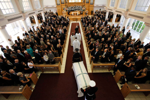 The casket bearing the body of former first lady Betty Ford is carried by members of the armed forces into St. Margaret's Episcopal Church in Palm Desert, California, July 12, 2011. Betty Ford, the wife of the late President Gerald Ford, who overcame alcohol and prescription drug addictions and helped found a rehabilitation clinic that bears her name, died on July 9, 2011 at the age of 93. <br/>Reuters / Jae C. Hong