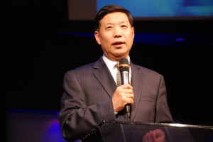 Pastor Zhang said the gospel is to pass out of death into life. <br/>YouTube Screen Capture