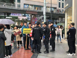 Police harass Early Rain Covenant Church members as they evangelize on the street.<br />
 <br/>(Photo: ChinaAid)