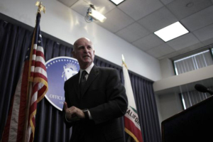 California Governor Jerry Brown leaves the podium after a media conference in Los Angeles, California June 16, 2011. <br/>Reuters / Lucy Nicholson