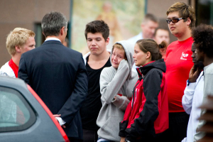 Norwegian Prime Minister Jens Stoltenberg (back to camera) meets with victims as he arrives at Sunvold Hotel July 23, 2011. Stoltenberg has arrived by helicopter at a hotel near the island where 84 people were gunned down on Friday during a Labour Party youth meeting. <br/>Reuters / Bjorn Larsson Rosvall/Scanpix
