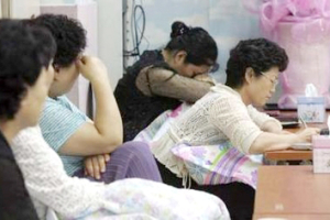 Family members of the 21 South Koreans kidnapped by the Taliban, react as they watch news report in Seongnam, south of Seoul August 12, 2007. Two seriously ill hostages are still in Taliban hands, a spokesman for the rebel group said on Sunday, but would be freed soon. <br/>(REUTERS/Jeon Gi-byong/Korea Pool)