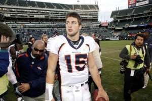 Denver Broncos' quarterback Tim Tebow walks off the field after Broncos defeated the Oakland Raiders in their NFL football game in Oakland, California November 6, 2011. <br/>Reuters/Beck Diefenbach