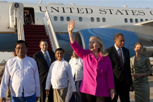 US Secretary of State Hillary Clinton waves alongside Burma's Deputy Foreign Minister Myo Myint (left) upon her arrival in Naypyidaw <br/>AP Photo/Saul Loeb
