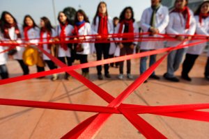 Medical students form a red ribbon, the symbol of the worldwide campaign against AIDS, during an HIV/AIDS awareness rally on World AIDS Day in central Istanbul December 1, 2011. <br/>REUTERS/Murad Sezer
