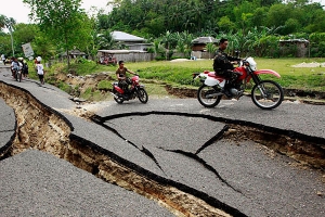 A road was destroyed by an earthquake in La Libertad, Negros Oriental in central Philippines on Monday. <br/>REUTERS/Erik De Castro