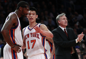 New York Knicks' Jeremy Lin (17) talks to teammate Amare Stoudemire (1) as head coach Mike D'Antoni calls out to the team during the first half of an NBA basketball game against the Sacramento Kings, Wednesday, Feb. 15, 2012, in New York. <br/>AP Photo/Frank Franklin II