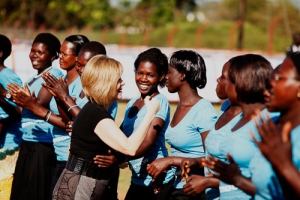 Marilyn Skinner, co-founder of Watoto, gives hugs to the Watoto women. <br/>Watoto