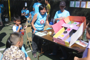 Games with bible messages prepared by the Church of United Brethren in Christ in New York draw attention from many children. <br/>Photo: The Gospel Herald
