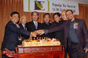 Pastor Francis Choi (Chief Executive Officer) (left one) stands together with the board directors in cutting cake. <br/>Equip to Serve