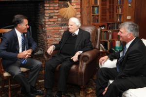 Billy Graham (center) and his son, Franklin, met with Gov. Mitt Romney during his visit to the evangelist's mountain home this afternoon, while in the region for a speaking engagement in Asheville this evening. <br/>A. Larry Ross Communications