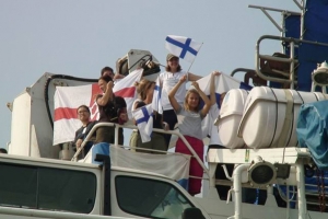 Crewmembers wave flag representing their nationality for this undated photo onboard the floating charity vessel, MV Doulos. The ship will make its last visit to Hong Kong, Sept. 11 thru Oct. 7, before its scheduled retirement in 2010. <br/>Photo: Operation Mobilization (Hong Kong)