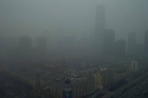 Skyscrapers in Beijing are obscured by a heavy haze on Jan. 13. <br/>AP