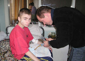 A Father’s House missionary gives medical help to a needy child. <br/>Intercede International 