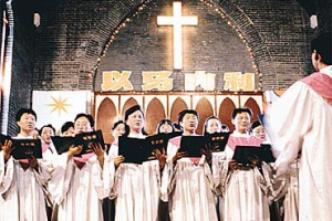 Chinese Christians sang hymns at St. Paul's Church in Nanjing. Despite continued Government repression of unregistered, illegal congregations, Protestantism, with millions of adherents, is gaining ground rapidly as China undergoes a strong religious revival. <br/>New York Times