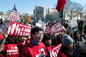 Crowds hold signs that says ''Every Child Deserves a Mom & Dad'', protesting against same-sex marriage outside the Supreme Court in Washington on March 26, 2013. <br/>