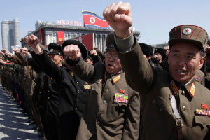 North Korean army officers punch the air as they chant slogans during a rally at Kim Il Sung Square in downtown Pyongyang, North Korea. <br/>Jon Chol Jin, AP