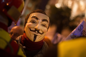 Protestor wears a mask of the 'Anonymous' hacking group during a march on February 23, 2013 in Madrid, Spain. <br/>Denis Doyles/Getty Images