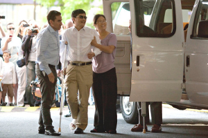 Chen Guangcheng, the blind Chinese dissident, arriving in New York on Saturday shortly after he landed at Newark Airport. <br/>Dave Sanders for The New York Times