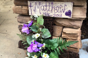 Flowers and cross display is part of a makeshift memorial at Saddleback Church for Pastor Rick Warren's son, Matthew, who took his own life on Friday after a lifelong battle with mental illness, according to his father, April 7, 2013. <br/>Christian Post/Alex Murashko