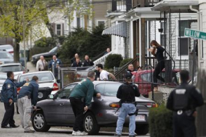 Police officers search homes for the Boston Marathon bombing suspects in Watertown, Massachusetts April 19, 2013. <br/>REUTERS/Jessica Rinaldi