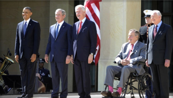 President Barack Obama and former presidents George W. Bush, Bill Clinton, George H.W. Bush and Jimmy Carter arrive on stage for the George W. Bush Presidential Center dedication ceremony in Dallas, on April 25, 2013. (JEWEL SAMAD/AFP/Getty Images) <br/>