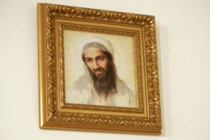The Blake Prize entry titled ''Bearded Orientals: Making the Empire Cross'' by artist Priscilla Bracks is exhibited in Sydney August 30, 2007. The ''double vision'' print, which depicts both Jesus Christ and Osama bin Laden, in a Christ-like pose, depending on which side the viewer looks at the artwork, has been criticised by Australia's Prime Minister John Howard for undermining Australians' religious beliefs. <br/>(REUTERS/Mick Tsikas)