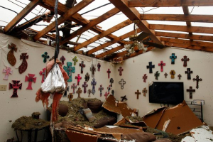The living room of a home that had its roof blown off by a tornado in Cleburne, Tex., on Thursday. <br/>Richard Rodriguez/Reuters