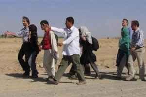 Released South Korean hostages are escorted in the city of Ghazni, August 29, 2007. <br/>(Shir Mohammad/Reuters) 