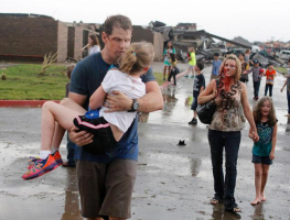Teachers carry children away from Briarwood Elementary school after a tornado destroyed the school in south Oklahoma City <br/>Paul Hellstern/The Oklahoman via AP 