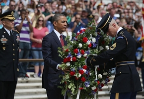President Obama positioned a commemorative wreath during a Memorial Day ceremony at Arlington National Cemetery. (Getty Images) <br/>